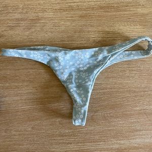 Benoa Swim bottoms. Thong with blue and white flower design